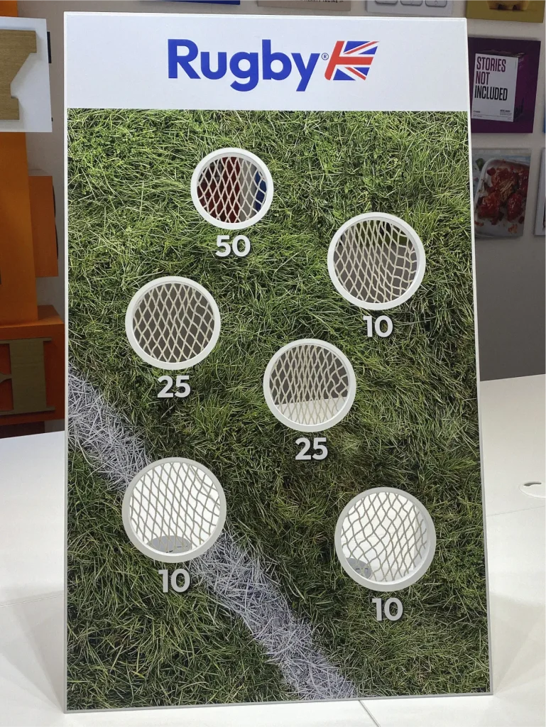 Interactive cemex bean bag toss game. Each bean bag looks like a mini cement bag.