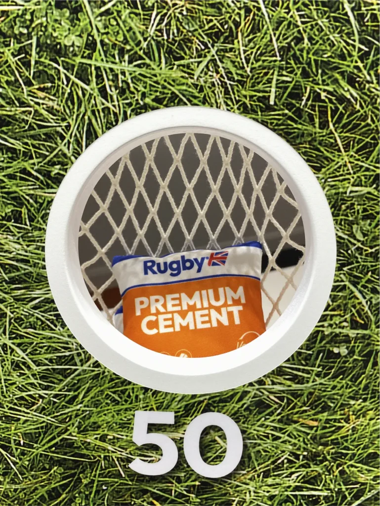 Interactive cemex bean bag toss game. Each bean bag looks like a mini cement bag.