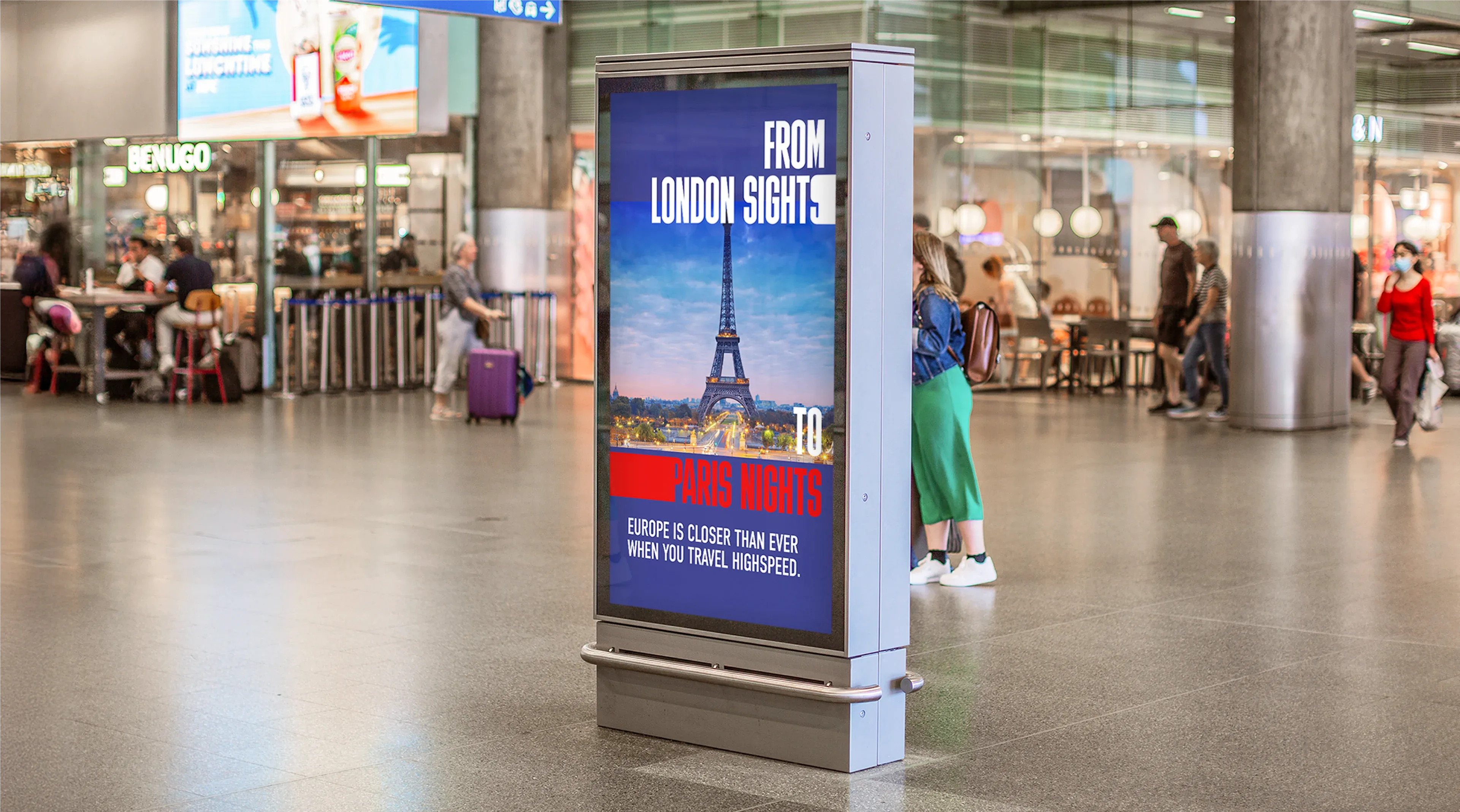 "From London Sights to Paris Nights" Freeze Frame poster. The poster has photography of the Eiffel Tower to showcase the range of cities that can be travelled to from St Pancras Station. Photographed in St Pancras Station on a digital interactive screen.