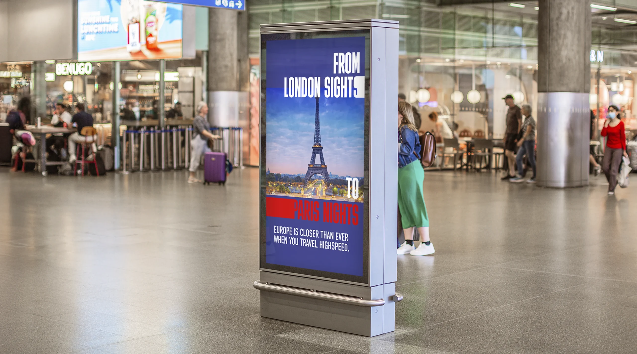 "From London Sights to Paris Nights" Freeze Frame poster. The poster has photography of the Eiffel Tower to showcase the range of cities that can be travelled to from St Pancras Station. Photographed in St Pancras Station on a digital interactive screen.