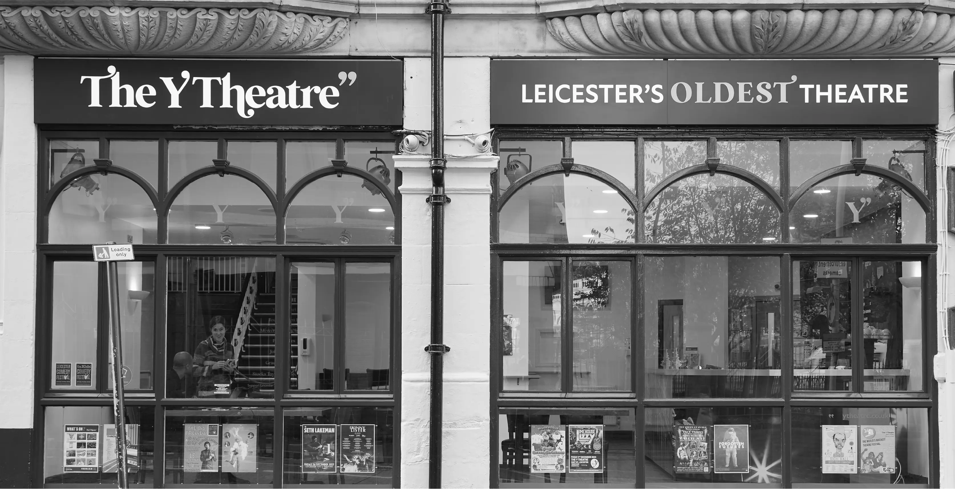 Black and white photograph of the exterior signage of The Y Theatre Leicester's oldest theatre.